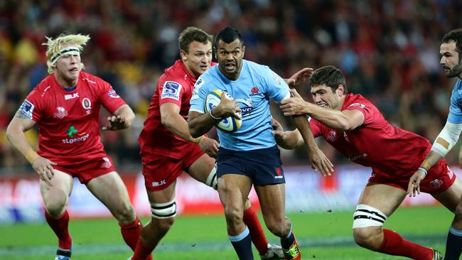 Kurtley Beale makes a break for the Waratahs.