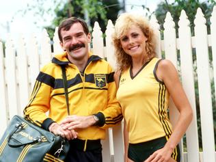 FEBRUARY 3, 1984 : Athletes Michelle Baumgartner & Robert De Castella model 1984 Olympic Games uniform to be worn in Los Angeles, 03/02/84, designed by Prue Acton. Pic New Ltd. Athletics Olympic1984