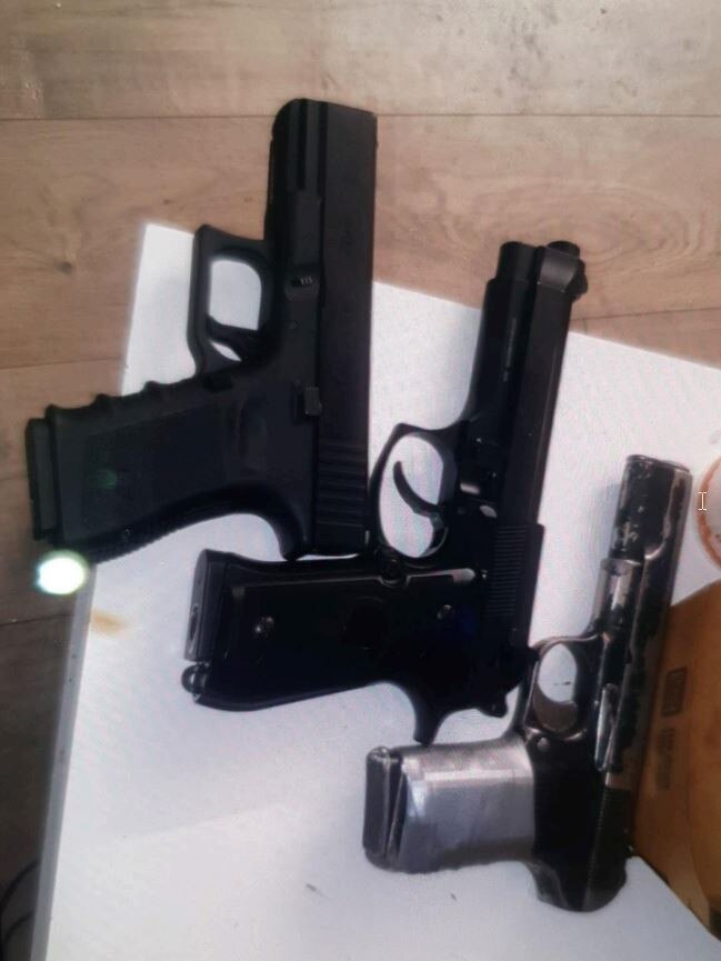 Images of firearms were allegedly stored on Robbie Hurmiz's phone.