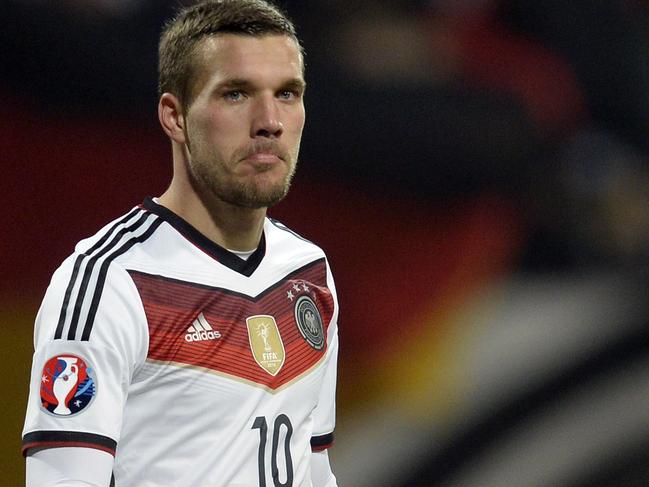 Germany's midfielder Lukas Podolski reacts after the UEFA 2016 European Championship qualifying round Group D football match Germany vs Gibraltar in Nuremberg, southern Germany on November 14, 2014. Germany won the match 4-0. AFP PHOTO / CHRISTOF STACHE