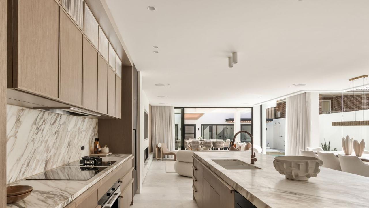 The property is set to smash suburb records. Marble finishes are prominent throughout.