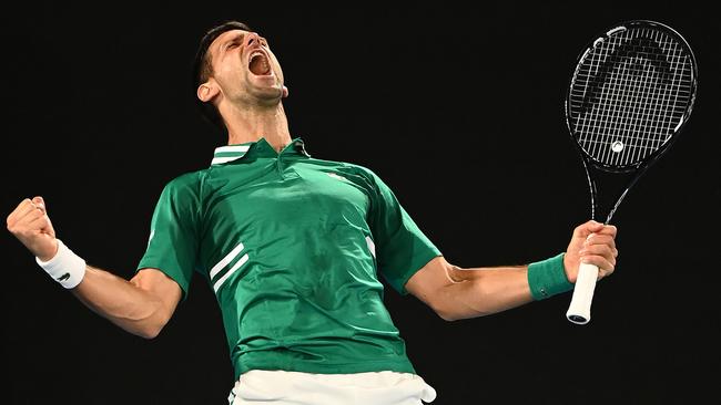 Novak Djokovic of Serbia celebrates winning match point