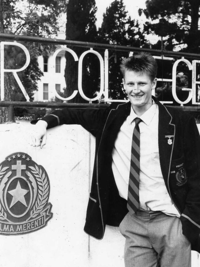 Ben Hart standing in front of Rostrevor’s school sign in 1991.