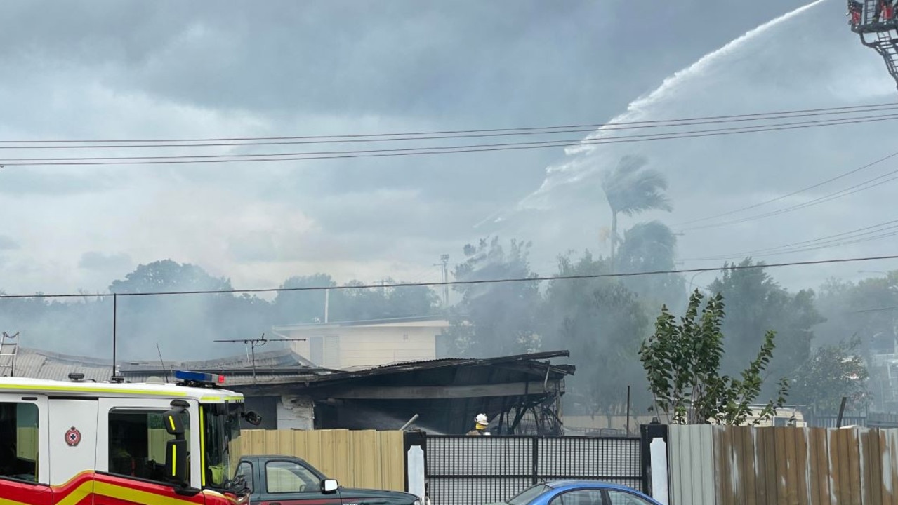 Firefighters attack the flames from above. Picture: Grace Koo