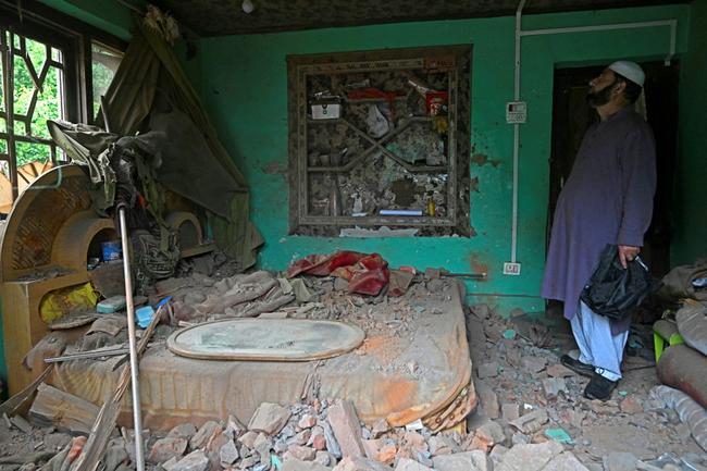 Worshippers held Friday prayers at a mosque in Pakistan-administered Kashmir that was damaged by Indian air strikes