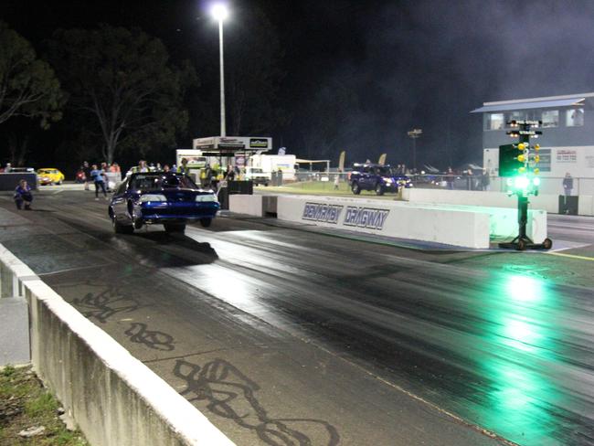 Trevor Batley gets the front wheels up on his Ford Mustang after travelling all the way from Mackay to compete in the CQDRA championship round three at Benaraby Dragway. Picture: Rodney Stevens