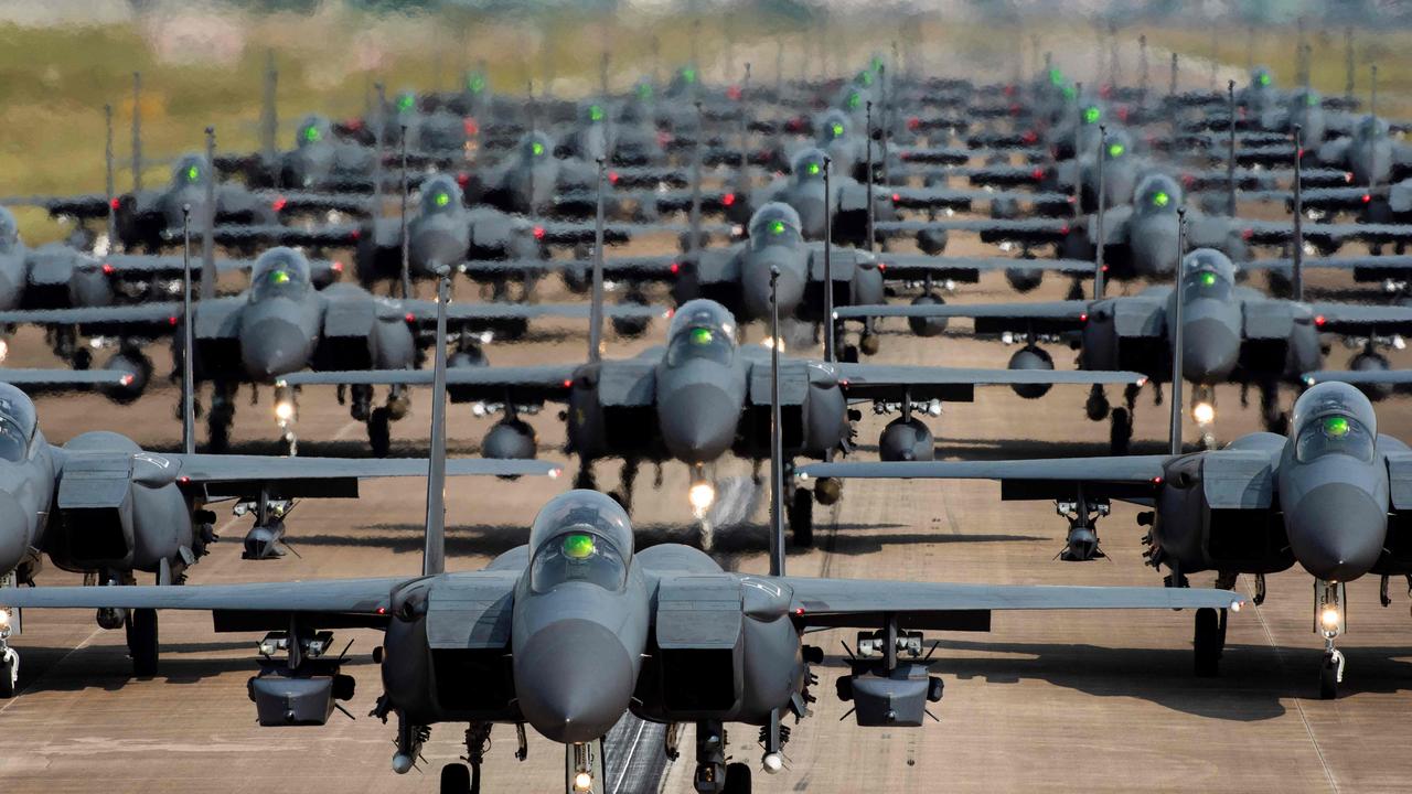 South Korean air force F-15K fighter planes demonstrating an Elephant Walk as they taxi down a runway. Picture: Handout/South Korean Defence Ministry/AFP