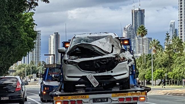 A tow truck removes a vehicle which crashed on the Gold Coast Highway in Southport after the driver suffered a medical incident. Picture: Keith Woods.