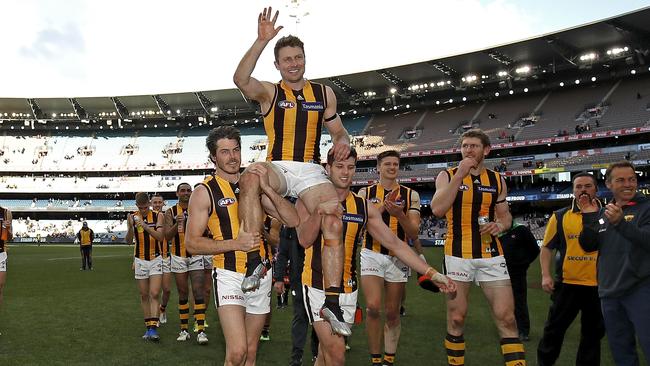 Liam Shiels is carried from the ground in his 200th game after Hawthorn’s win. Picture: Getty Images