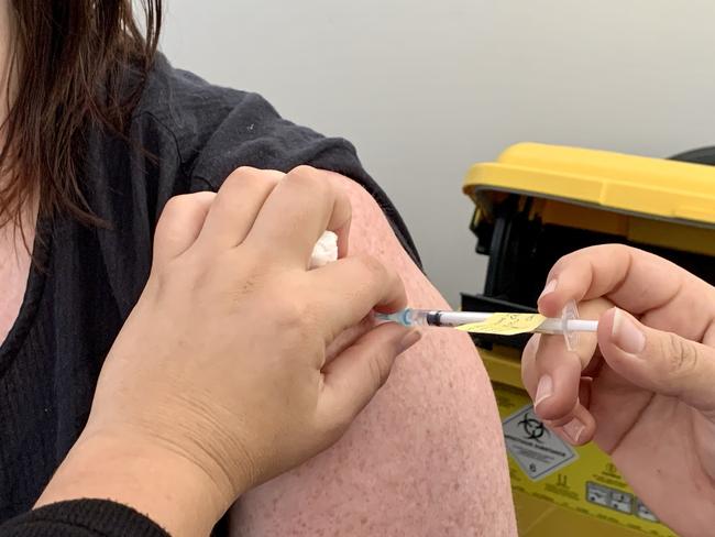 Daily Mercury editor Rae Wilson getting her Covid-19 Pfizer vaccination at the new vaccination hub at CQUniversity's Mackay city campus. Generic, covid, jab, needle, vaccine, Pfizer, covid Mackay, coronavirus.