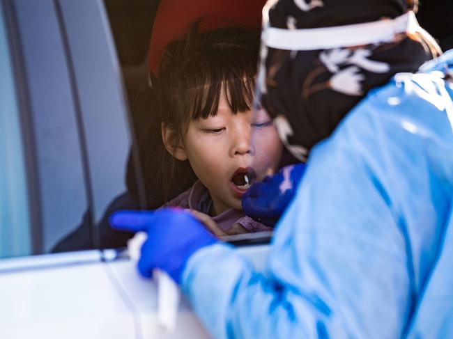 BRISBANE, AUSTRALIA - NewsWire Photos - AUGUST 6, 2021. A young girl is being swabbed at a pop up Covid-19 testing clinic at Eight Miles Plains in Brisbane's south, as Queensland remains in lockdown due to a growing covid cluster.Picture: NCA NewsWire / Dan Peled