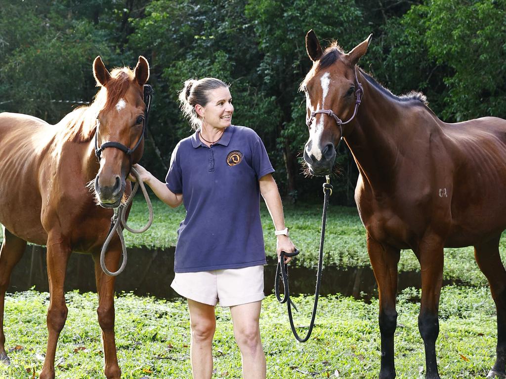 Racing Queensland has partnered with equine therapist Lara Baker, giving former race horses a new life by helping people with physical and mental illnesses, as well as those recovering from addiction. Lara Baker of Mindful Therapy Cairns trains thoroughbreds Huey and Leaper to work as therapeutic horses on her Speewah property. Picture: Brendan Radke