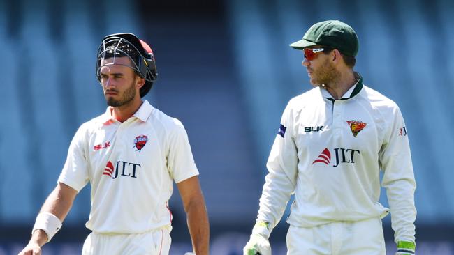 Australian captain Tim Paine, right, with the Redbacks centurion Jake Weatherald during the Sheffield Shield clash between South Australia and Tasmania at Adelaide Oval this week. Picture: AAP Image/David Mariuz