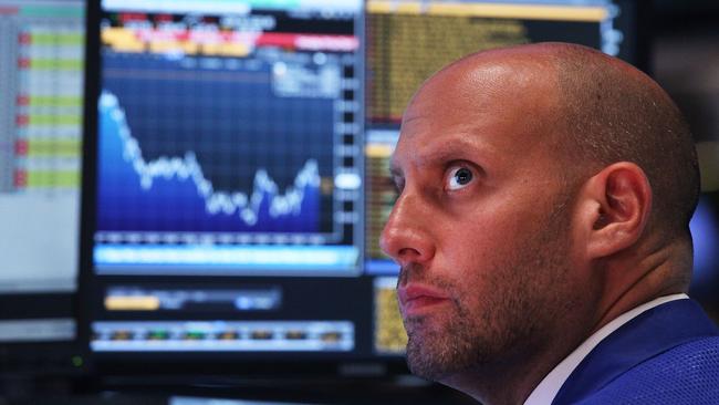 NEW YORK, NY - JULY 21: A trader works on the floor of the New York Stock Exchange (NYSE) on July 21, 2015 in New York City. The Dow fell over 170 points partly on news that earnings at IBM and United Technologies plunged about 5.9 percent and 7 percent, respectively. Spencer Platt/Getty Images/AFP == FOR NEWSPAPERS, INTERNET, TELCOS & TELEVISION USE ONLY ==