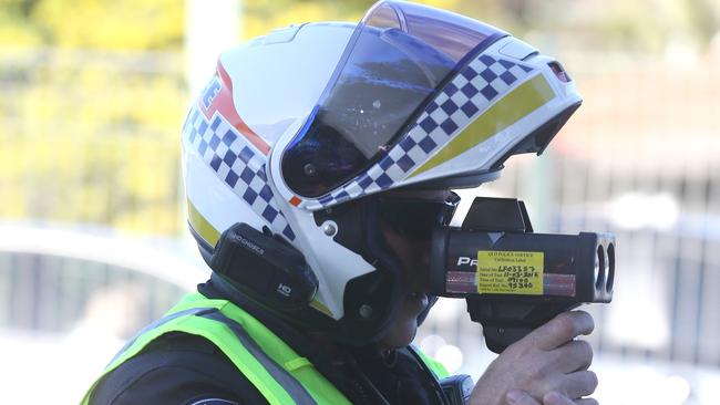 A police officer pictured during a traffic operation along the Gold Coast Highway in Miami. Picture: Regi Varghese.