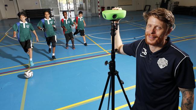 Islamic College of Brisbane futsal coach Craig Burchell with Year 7 students Muhammad Shaheer Khan, Suhayb Abdulmajid, Kemo Kenneh, and Bassam Younes. Photo: Josh Woning.