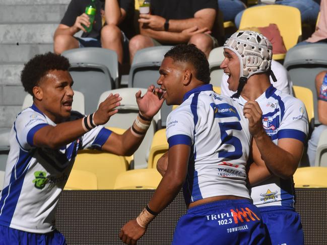 Final of the Arron Payne Cup between Ignatius Park College and St Patrick's College at the Queensland Country Bank Stadium. Ignatius Park's Rayzarlin Pearson celebrates try with teammates Elijah Joe and Izaya Leedie. Picture: Evan Morgan