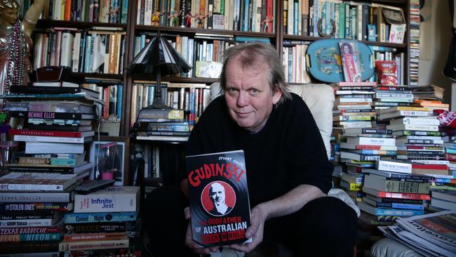 Author Stuart Coupe in 2015 with a copy of his book Gudinski: The Godfather of Australian Rock ‘n’ Roll. Picture: Craig Wilson