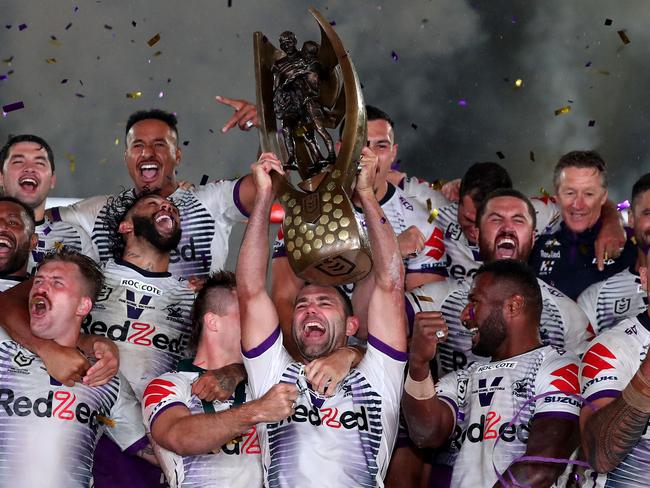 SYDNEY, AUSTRALIA - OCTOBER 25: Cameron Smith of the Storm holds aloft the Premiership trophy and celebrates with team mates after winning the 2020 NRL Grand Final match between the Penrith Panthers and the Melbourne Storm at ANZ Stadium on October 25, 2020 in Sydney, Australia. (Photo by Cameron Spencer/Getty Images)