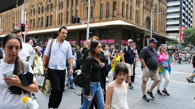 SYDNEY, AUSTRALIA : NewsWire Photos - DECEMBER 02 2024; Busy shoppers are seen walking across George Street in the Sydney CBD as Retail stores are now decorated with Christmas decorations and filled with special sales four weeks till Christmas. Picture: NewsWire / Gaye Gerard