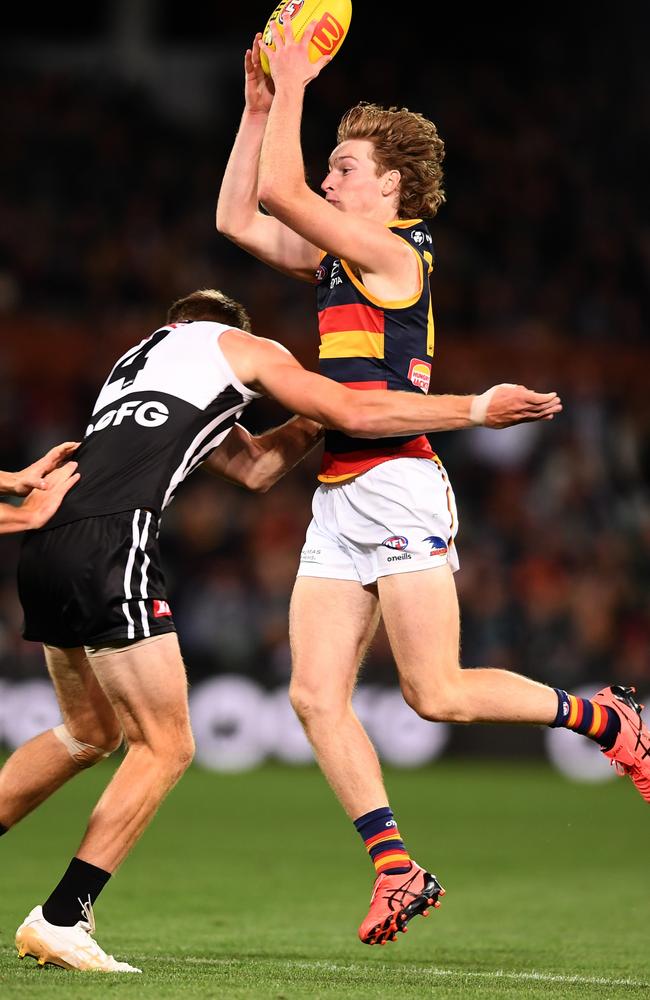 Todd Marshall tackles Crows defender Max Michalanney. Picture: Mark Brake/Getty Images