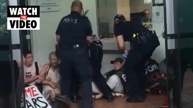 Police arrest protesters at government building sit-in