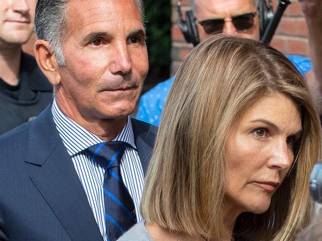 Actress Lori Loughlin and husband Mossimo Giannulli exit the Boston Federal Court house after a pre-trial hearing. Picture: AFP