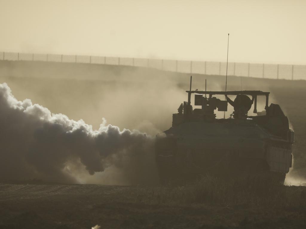 An Israeli tank moves along the border with Gaza in southern Israel. Picture: Getty Images