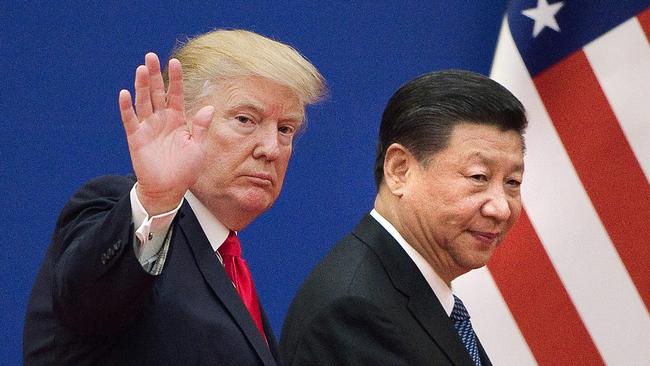 US President Donald Trump and Xi Jinping leave a business leaders event in Beijing in 2017.