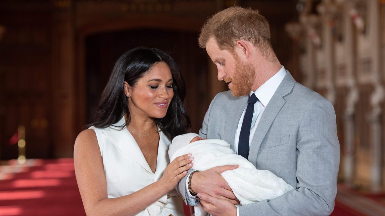 (FILES) In this file photo taken on May 08, 2019 Britain's Prince Harry, Duke of Sussex (R), and his wife Meghan, Duchess of Sussex, pose for a photo with their newborn baby son, Archie Harrison Mountbatten-Windsor, in St George's Hall at Windsor Castle in Windsor, west of London on May 8, 2019. - Meghan Markle has revealed she suffered a miscarriage in July this year, writing in the New York Times on November 25, 2020 of the deep grief and loss she endured with her husband Prince Harry. (Photo by Dominic Lipinski / POOL / AFP)