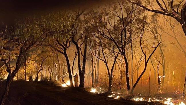 A strike team of volunteer firefighters backburned 5km of terrain in the ongoing fight against the Gospers Mountain fire.