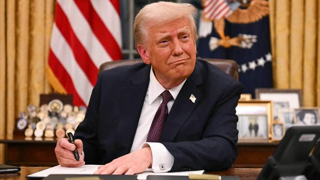 US President Donald Trump signs executive orders in the Oval Office. Picture: AFP