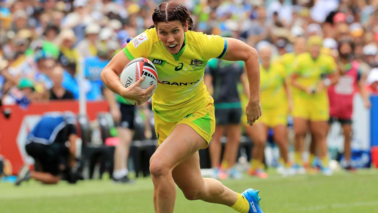 Charlotte Caslick in action for Australia. AFP PHOTO: MARK EVANS