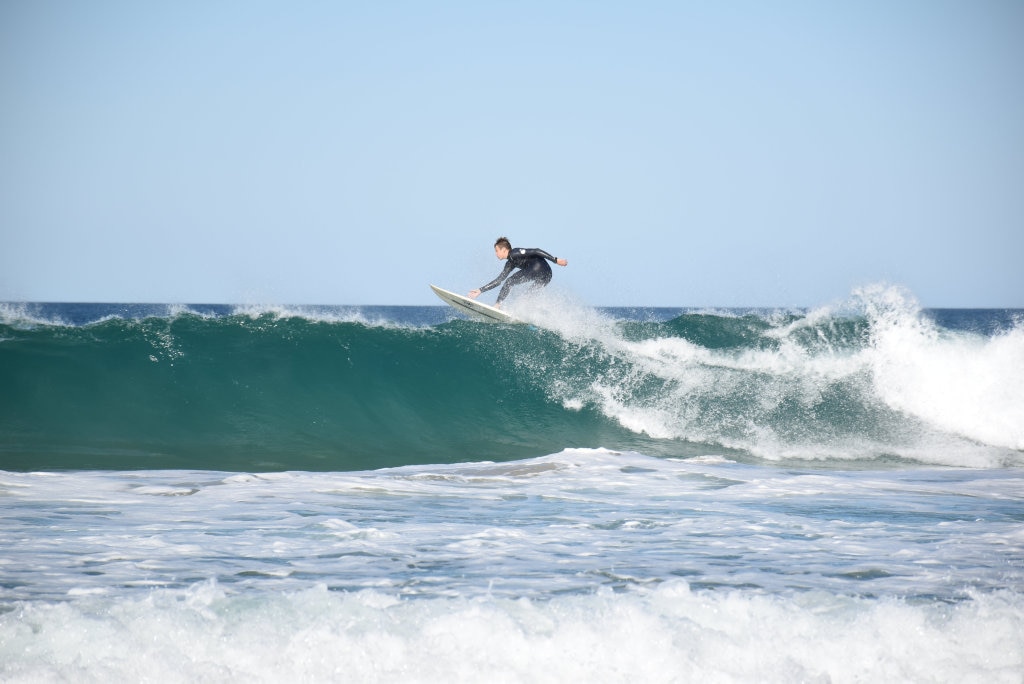 Surfers and bodyboard riders making the most of the waves at Kawana on the weekend. Picture: Mark Furler