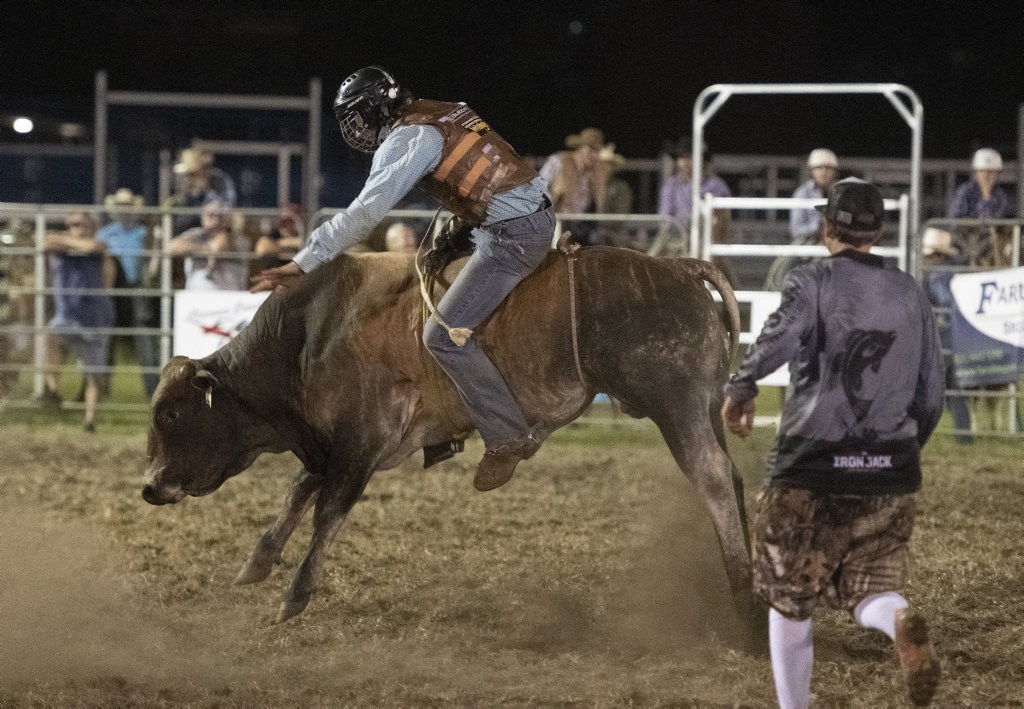 Tylah Wilson rides in the junior bullride at the Lawrence Twilight Rodeo. Picture: Adam Hourigan