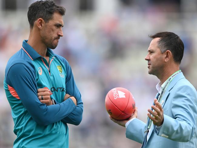 Mitchell Starc speaks to Ricky Ponting as he sat out the first test. Picture: Stu Forster/Getty Images