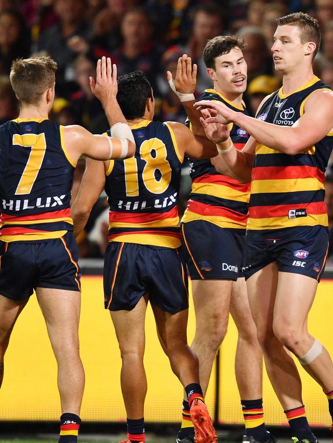 Crows players celebrate a goal against Carlton. Picture: AAP Image/David Mariuz