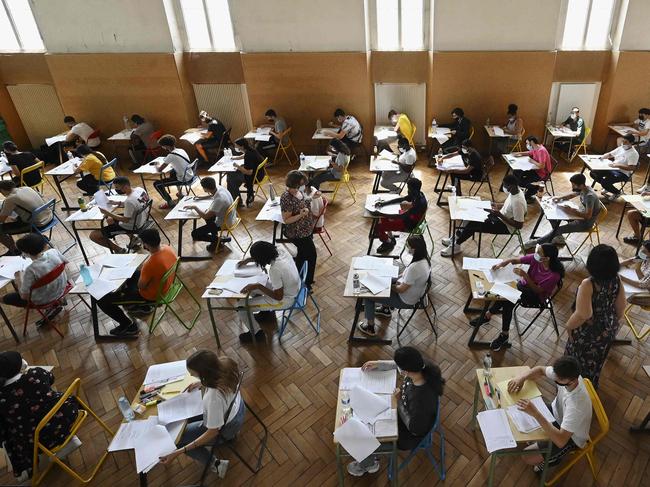 (FILES) High school students take the French exam, the first test session of the 2021 baccalaureate (high school graduation exam) on June 17, 2021 at the Pasteur high school in Strasbourg, eastern France. The 2024 edition of the national baccalaureat exams begins on June 14, 2024. (Photo by FREDERICK FLORIN / AFP)