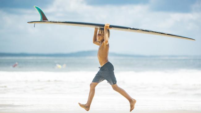 Ryder Worthington 12, getting ready for a surf at First Point at the Noosa. Picture Lachie Millard