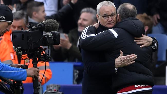 Claudio Ranieri manager of Leicester City and Francesco Guidolin, manager of Swansea City embrace.