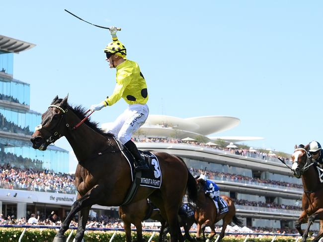 MELBOURNE, AUSTRALIA - NOVEMBER 07: Mark Zahra riding Without a Fight wins the Lexus Melbourne Cup during Melbourne Cup Day at Flemington Racecourse on November 07, 2023 in Melbourne, Australia. (Photo by Quinn Rooney/Getty Images)