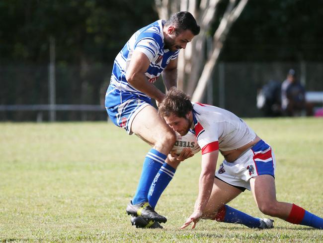 Brothers' Luke Fleming drags Ivanhoe's Kelly Valmadres in a tackle in the Cairns District Rugby League (CDRL) Round 16 match between the Ivanhoe Knights and Cairns Brothers, held at the Smithfield Sporting Complex. Picture: Brendan Radke