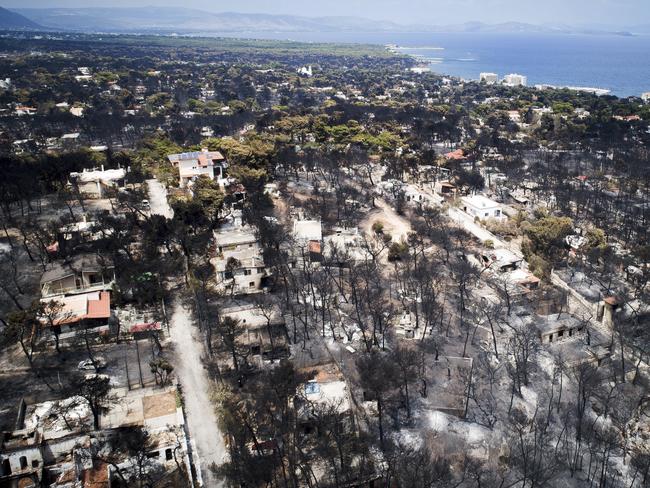 Aerial photo shows burnt houses and trees following a wildfire in Mati, east of Athens. Picture: AP