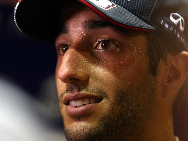 SINGAPORE - SEPTEMBER 19: Daniel Ricciardo of Australia and Infiniti Red Bull Racing speaks with members of the media after practice ahead of the Singapore Formula One Grand Prix at Marina Bay Street Circuit on September 19, 2014 in Singapore, Singapore. (Photo by Dan Istitene/Getty Images)