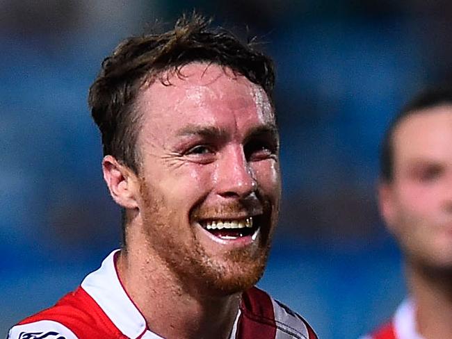 TOWNSVILLE, AUSTRALIA - MARCH 07: James Maloney of the Roosters laughs at Johnathan Thurston of the Cowboys during the round one NRL match between the North Queensland Cowboys and the Sydney Roosters at 1300SMILES Stadium on March 7, 2015 in Townsville, Australia. (Photo by Ian Hitchcock/Getty Images)