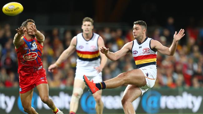 Rory Atkins kicks the ball against the Suns on Saturday evening. Picture: Chris Hyde/Getty Images