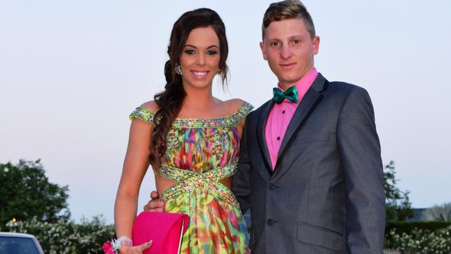 Kellie Garrett and Ben Moller go for the colourful approach at the Roma State College formal. Photo Tom Gillespie / The Western Star