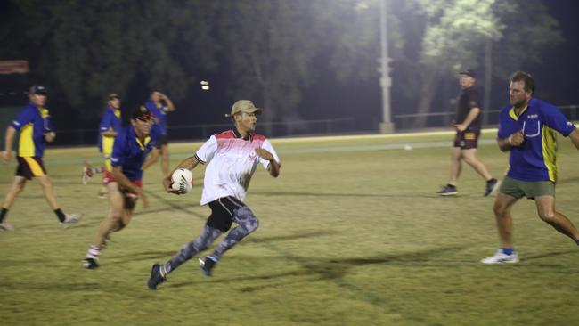 An Eidsvold player runs with the ball the Mundubbera v Eidsvold touch game on Friday night.