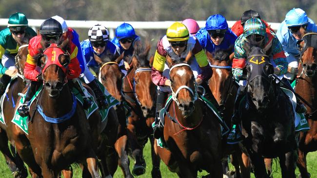 Loving home ridden by Tye Angland  (yellow cap, maroon with yellow armbands) wins race 1 during Scone  Races located in the Upper Hunter Region of NSW. The Bend . Pic Jenny Evans
