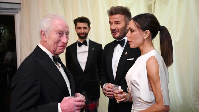 King Charles III with Victoria and David Beckham.